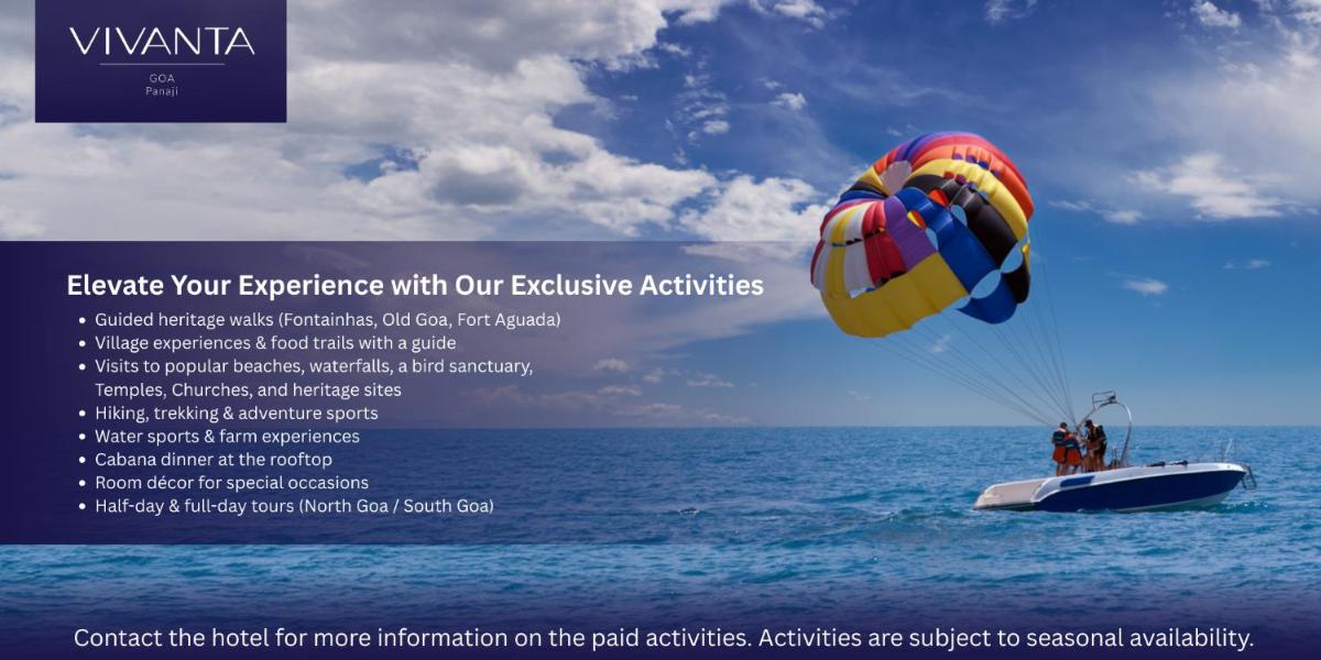 a person riding a parachute in the water at Vivanta Goa, Panaji in Panaji a person riding a parachute in the water at Vivanta Goa, Panaji in Panaji