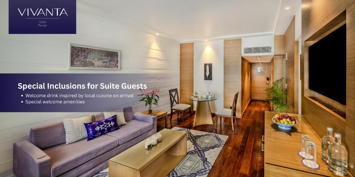 a living room with a couch and a table at Vivanta Goa, Panaji in Panaji a living room with a couch and a table at Vivanta Goa, Panaji in Panaji