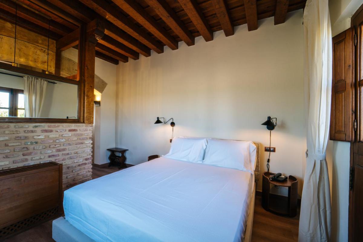 Cama o camas de una habitación en Abba las Viñas Tiedra