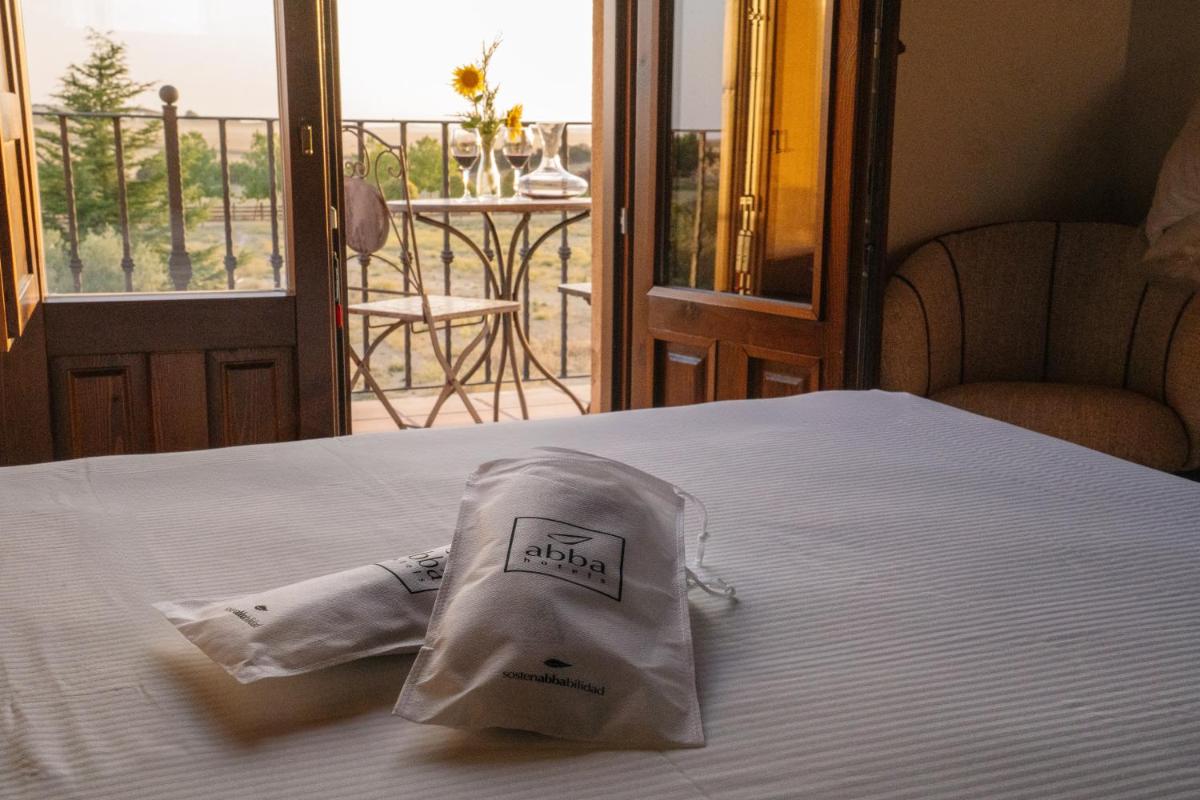 Cama o camas de una habitación en Abba las Viñas Tiedra