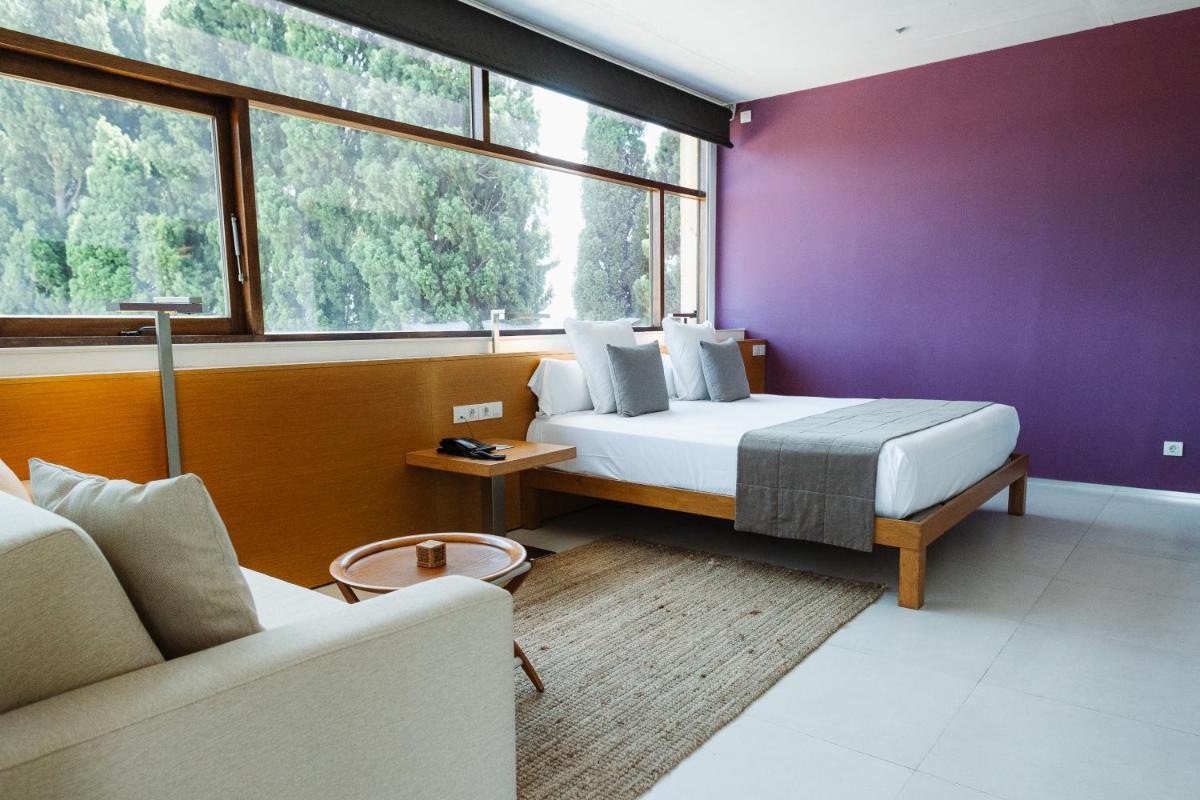 Cama o camas de una habitación en URH - Hotel Molí del Mig