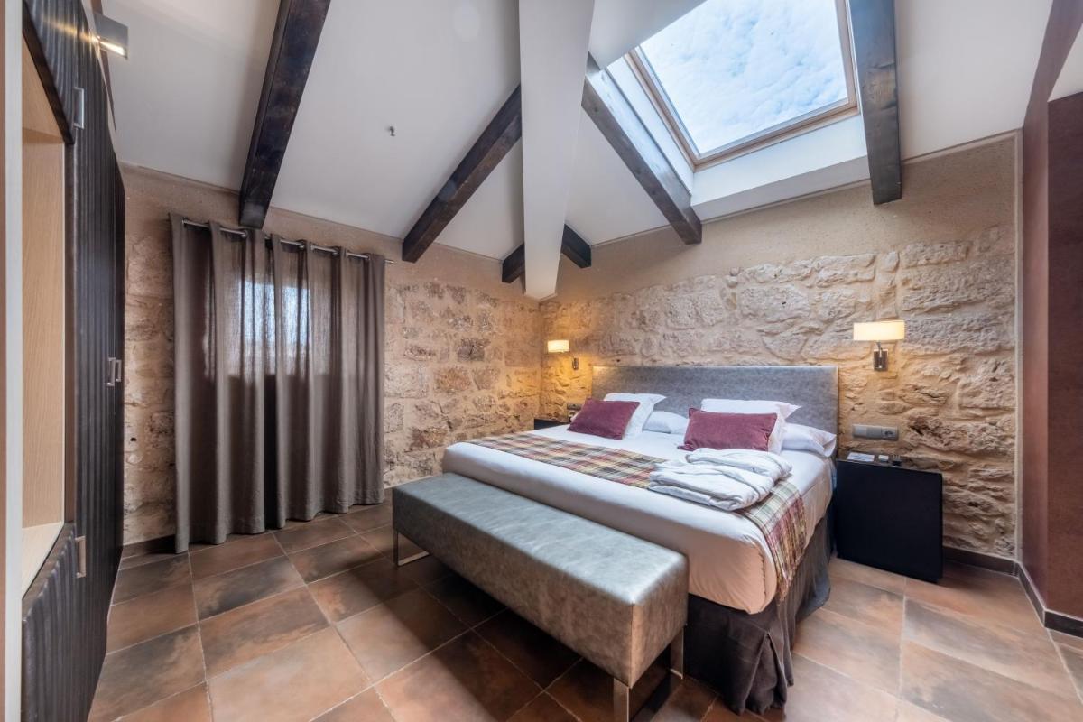 Cama o camas de una habitación en Castilla Termal Burgo de Osma