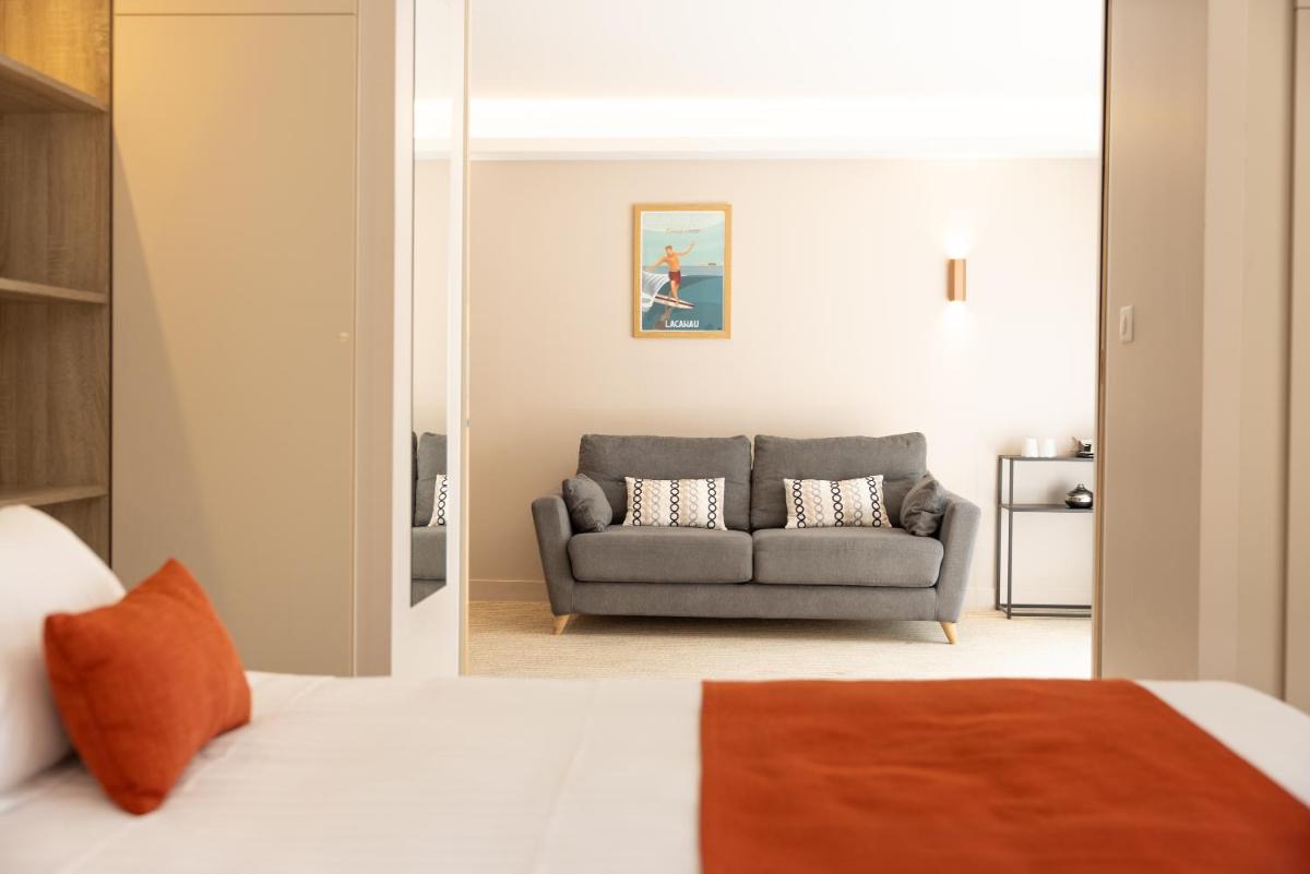 Un ou plusieurs lits dans un hébergement de l'établissement Hôtel & Spa Vitalparc, The Originals Collection