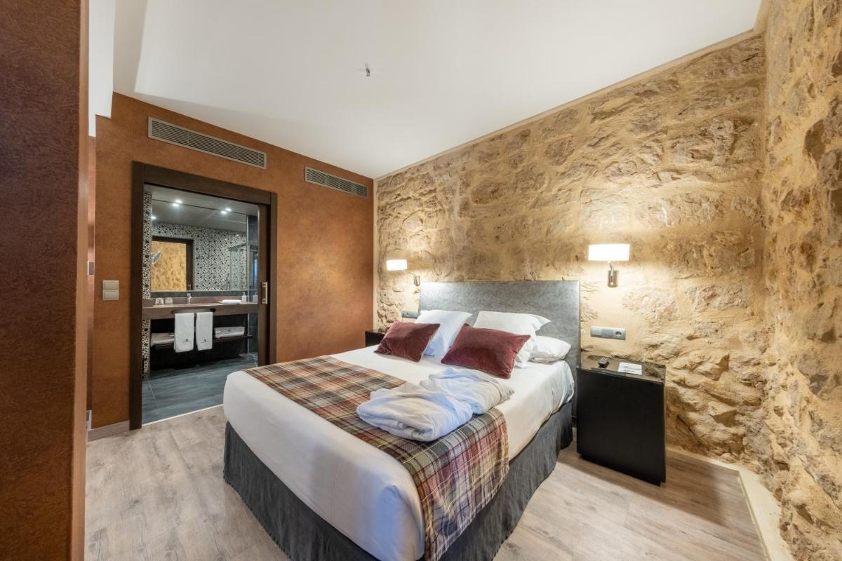Cama o camas de una habitación en Castilla Termal Burgo de Osma