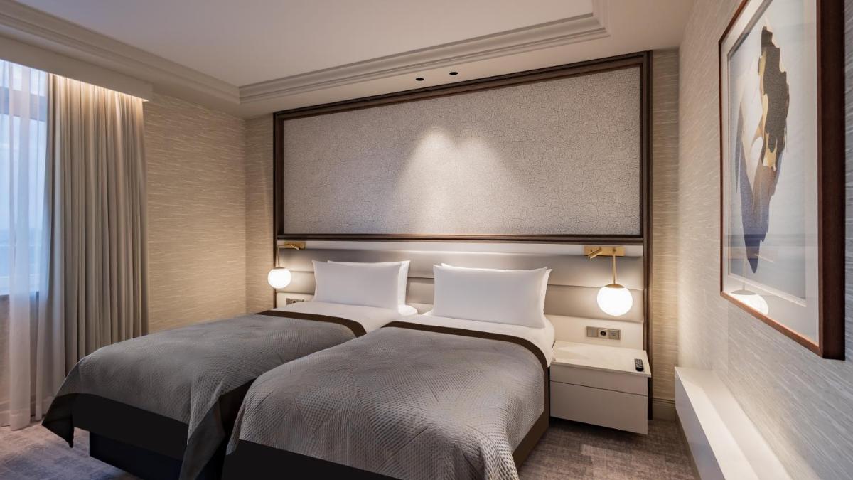Ein Bett oder Betten in einem Zimmer der Unterkunft InterContinental Berlin by IHG