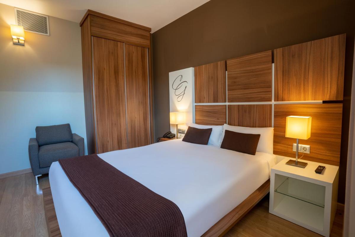Cama o camas de una habitación en Hotel & Spa Golden Barcelona