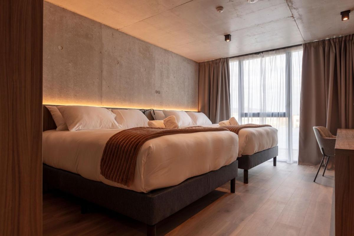 Un ou plusieurs lits dans un hébergement de l'établissement Ki Space Hotel & Spa - near Disneyland Paris