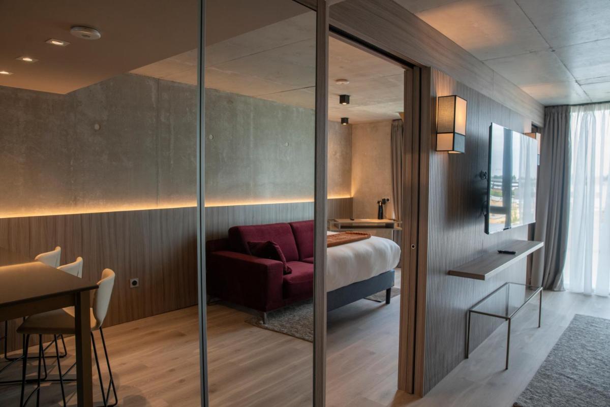 Un ou plusieurs lits dans un hébergement de l'établissement Ki Space Hotel & Spa - near Disneyland Paris