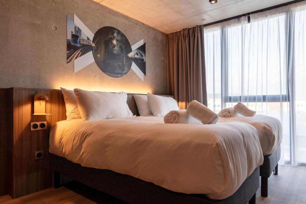 Un ou plusieurs lits dans un hébergement de l'établissement Ki Space Hotel & Spa - near Disneyland Paris