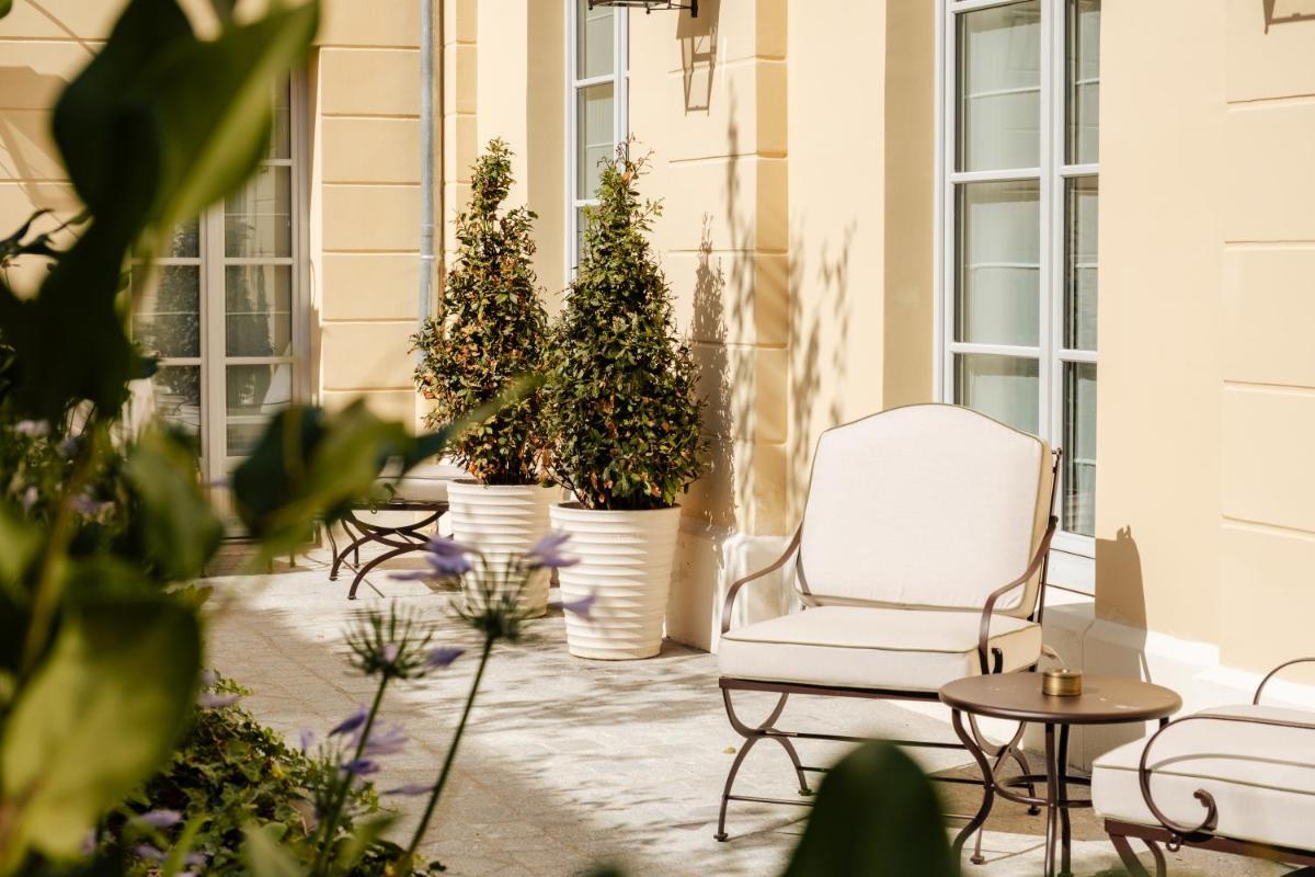 Jardin de l'établissement Hôtel Les Lumières - Relais & Châteaux