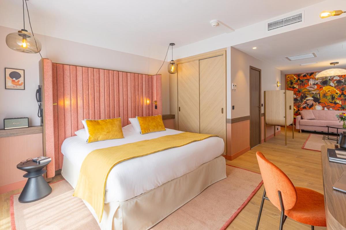 Un ou plusieurs lits dans un hébergement de l'établissement Le Riviera - Hôtel Restaurant & Spa - Ex Golden Tulip Aix les bains