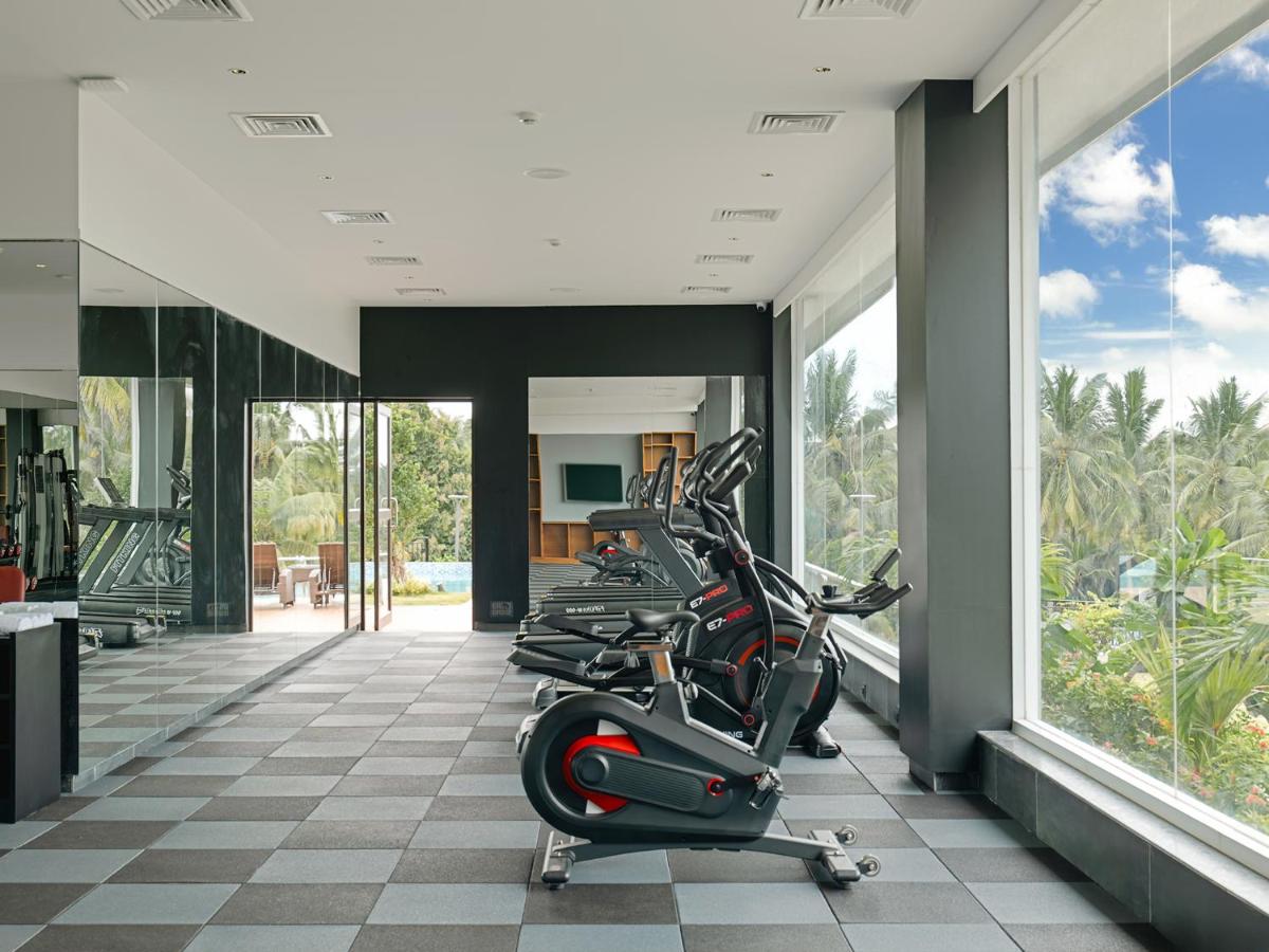 a fitness room with treadmills and elliptical machines at Gateway Goa, Palolem in Palolem