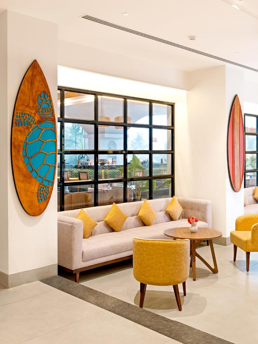 a living room with a couch and a table at Gateway Goa, Palolem in Palolem
