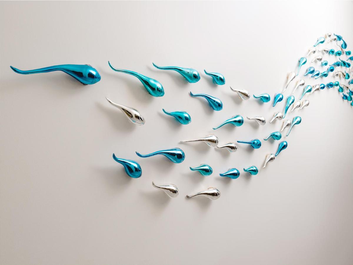 a group of blue birds flying in formation at Gateway Goa, Palolem in Palolem
