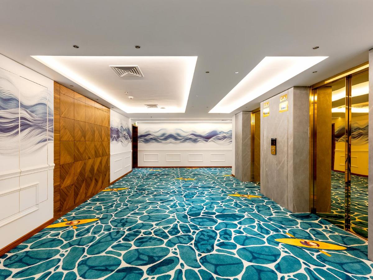a hallway with a colorful floor in a hotel at Gateway Goa, Palolem in Palolem