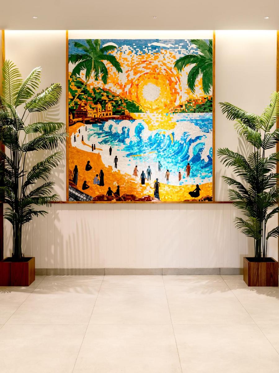 a large painting hanging on a wall in a building at Gateway Goa, Palolem in Palolem