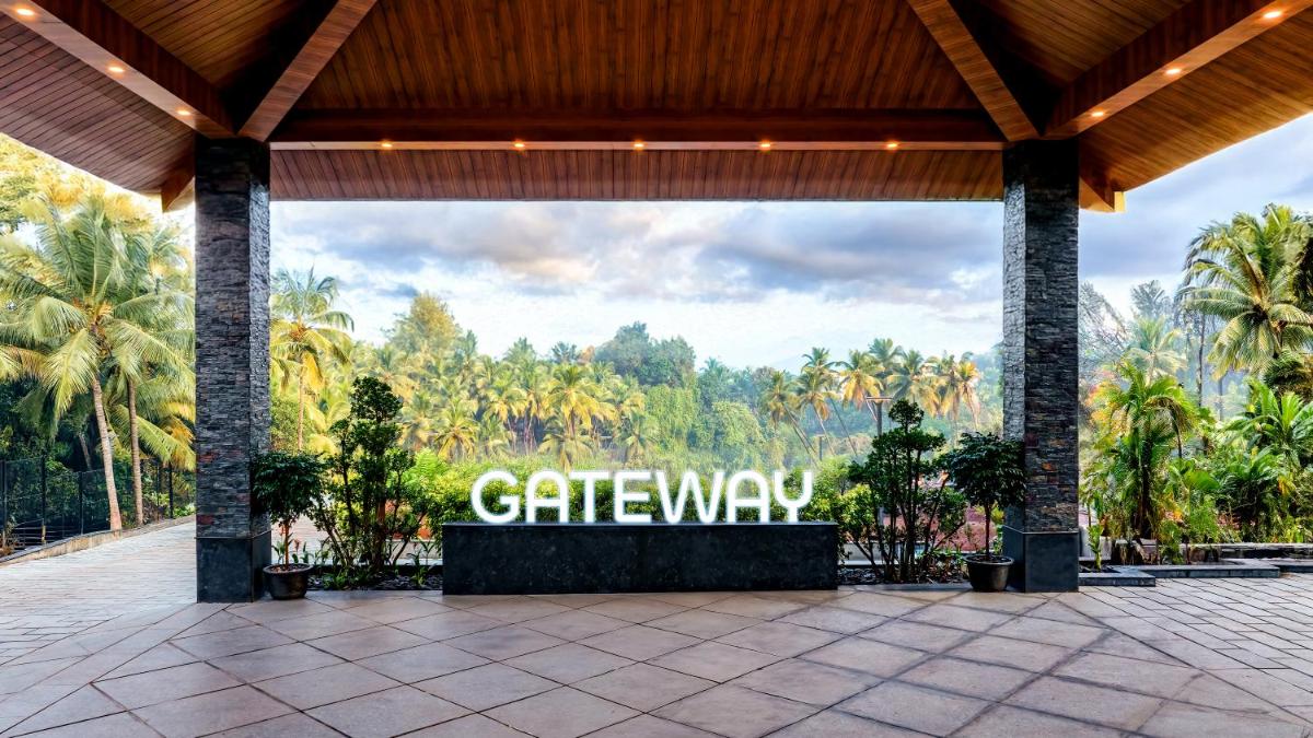a large sign that reads gateway in front of trees at Gateway Goa, Palolem in Palolem