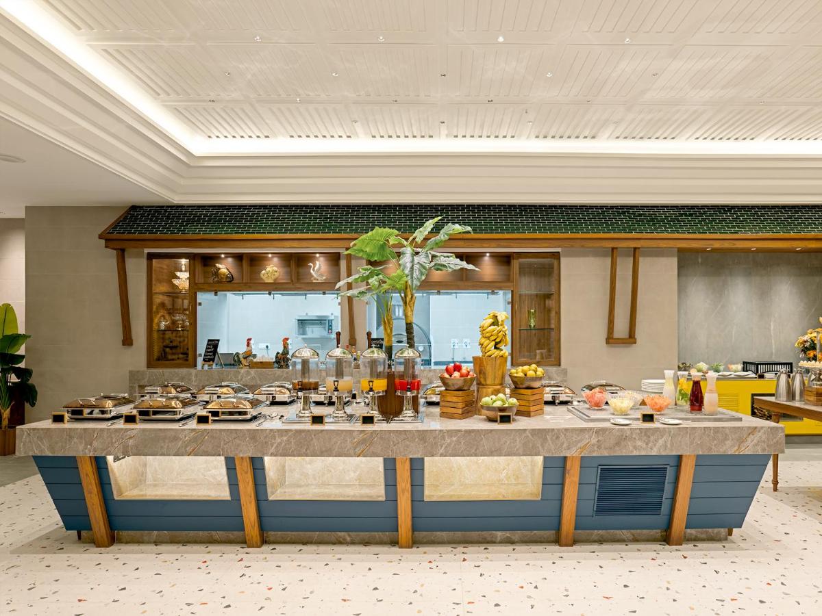 a large table in a room with food on it at Gateway Goa, Palolem in Palolem