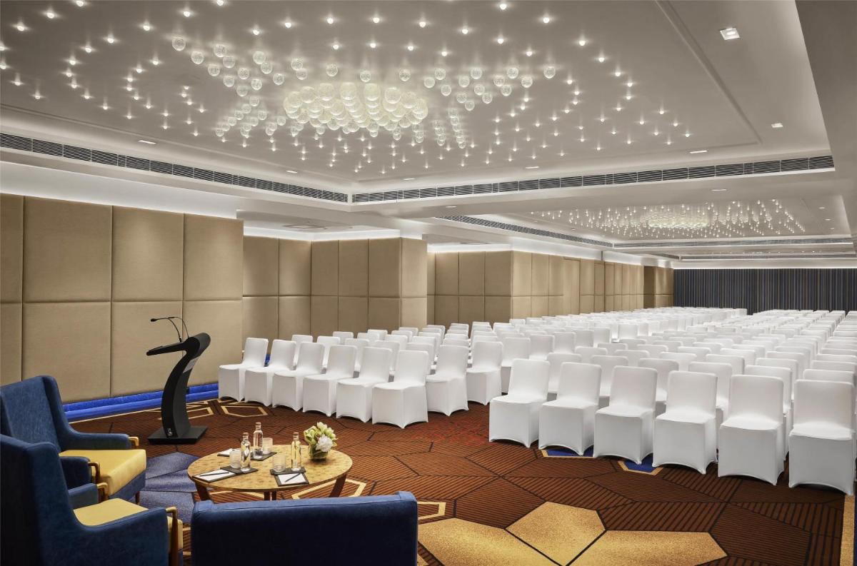 a conference room with a rows of chairs and tables at Hyatt Centric Sector17 Chandigarh in Chandīgarh