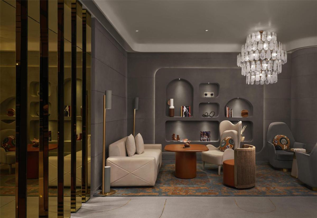 a rendering of a living room with a chandelier at Hyatt Centric Sector17 Chandigarh in Chandīgarh