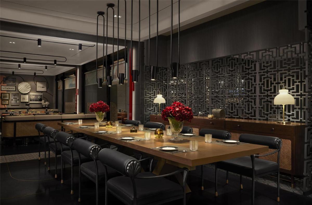 a dining room with a long table and chairs at Hyatt Centric Sector17 Chandigarh in Chandīgarh
