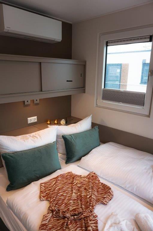 Ein Bett oder Betten in einem Zimmer der Unterkunft Schwimmende Häuser im BALTIC SEA RESORT