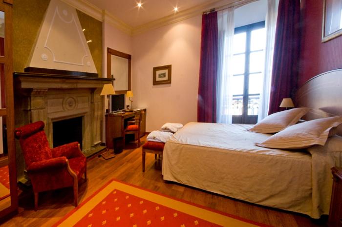 Cama o camas de una habitación en Hotel Palacio de la Magdalena