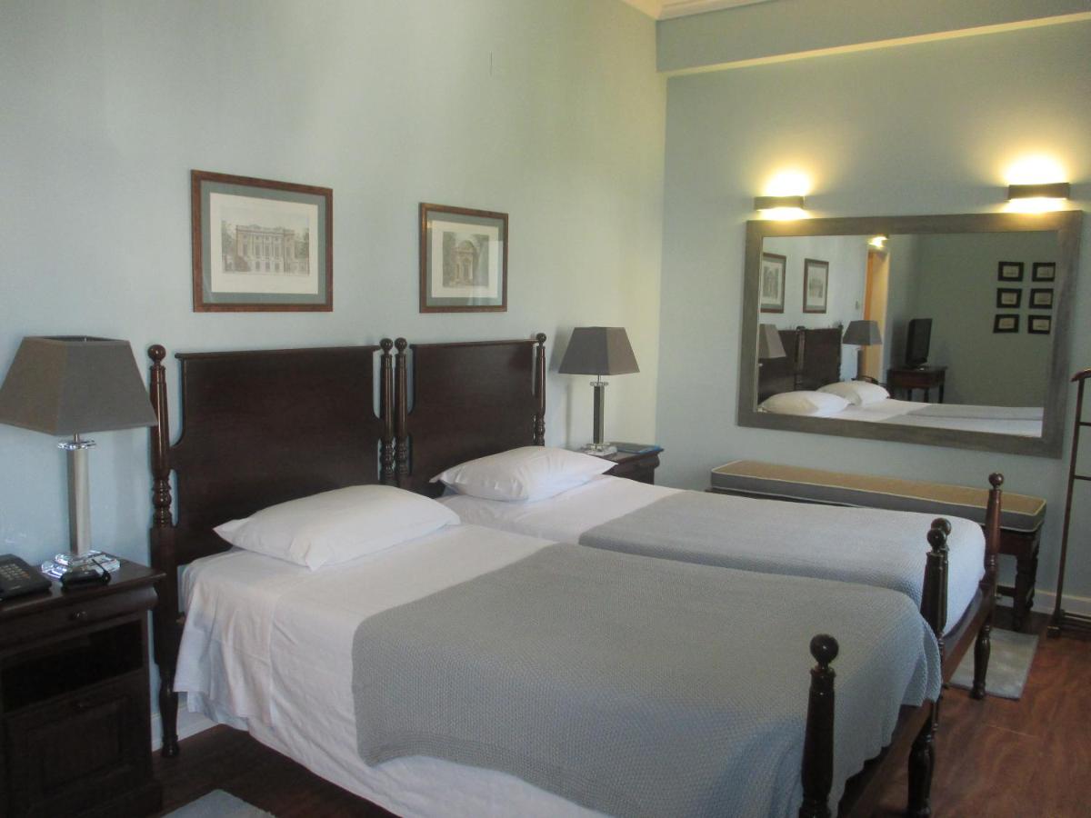 Uma cama ou camas num quarto em Grande Hotel das Caldas da Felgueira