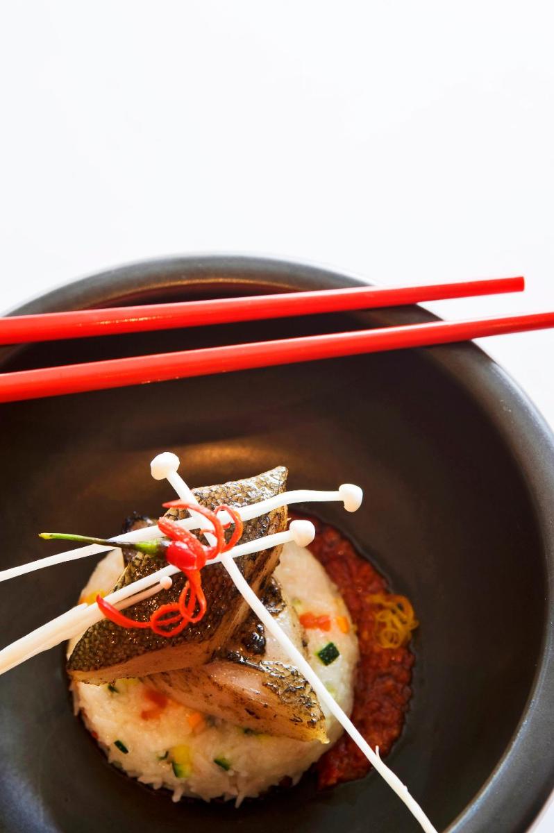 a bowl of food with chopsticks on top of it at The Taj Mahal Tower, Mumbai in Mumbai a bowl of food with chopsticks on top of it at The Taj Mahal Tower, Mumbai in Mumbai
