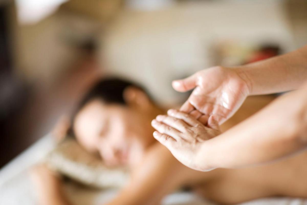 a woman holding the hand of a person at The Taj Mahal Tower, Mumbai in Mumbai a woman holding the hand of a person at The Taj Mahal Tower, Mumbai in Mumbai