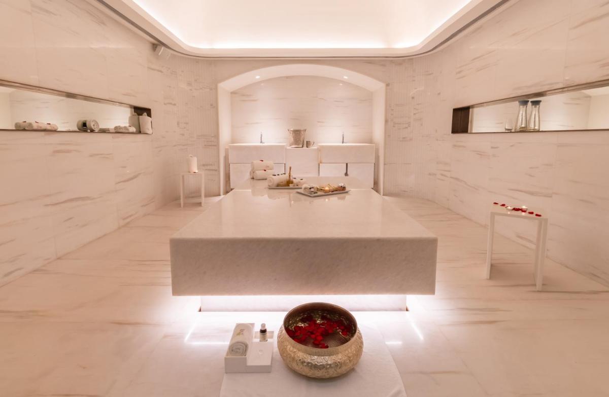 a large white room with a large table in it at The Taj Mahal Tower, Mumbai in Mumbai a large white room with a large table in it at The Taj Mahal Tower, Mumbai in Mumbai