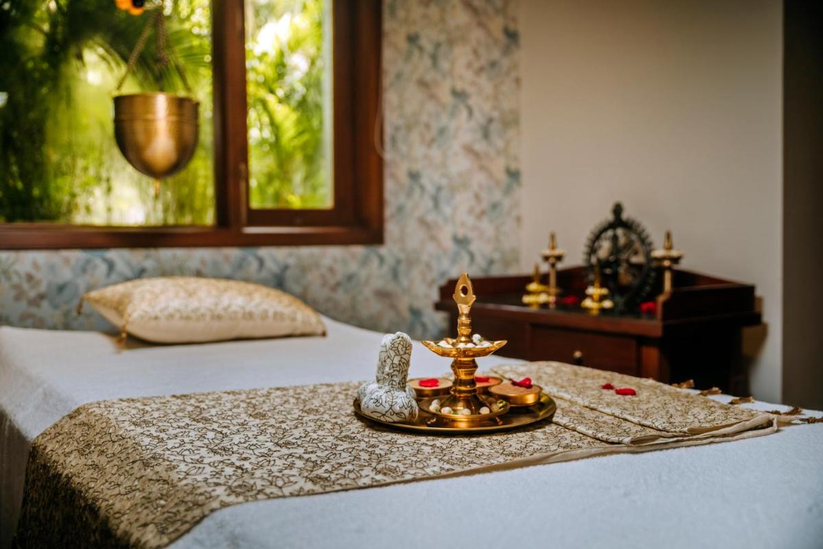 a bed with a tray on top of it at The Taj Mahal Tower, Mumbai in Mumbai a bed with a tray on top of it at The Taj Mahal Tower, Mumbai in Mumbai