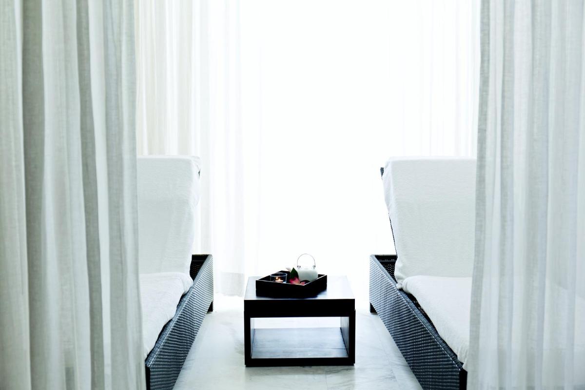 Uma área de estar em Troia Design Hotel