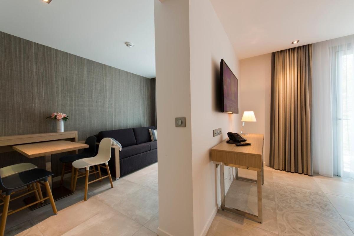 Coin salon dans l'établissement Golden Tulip Sophia Antipolis - Hotel & Spa