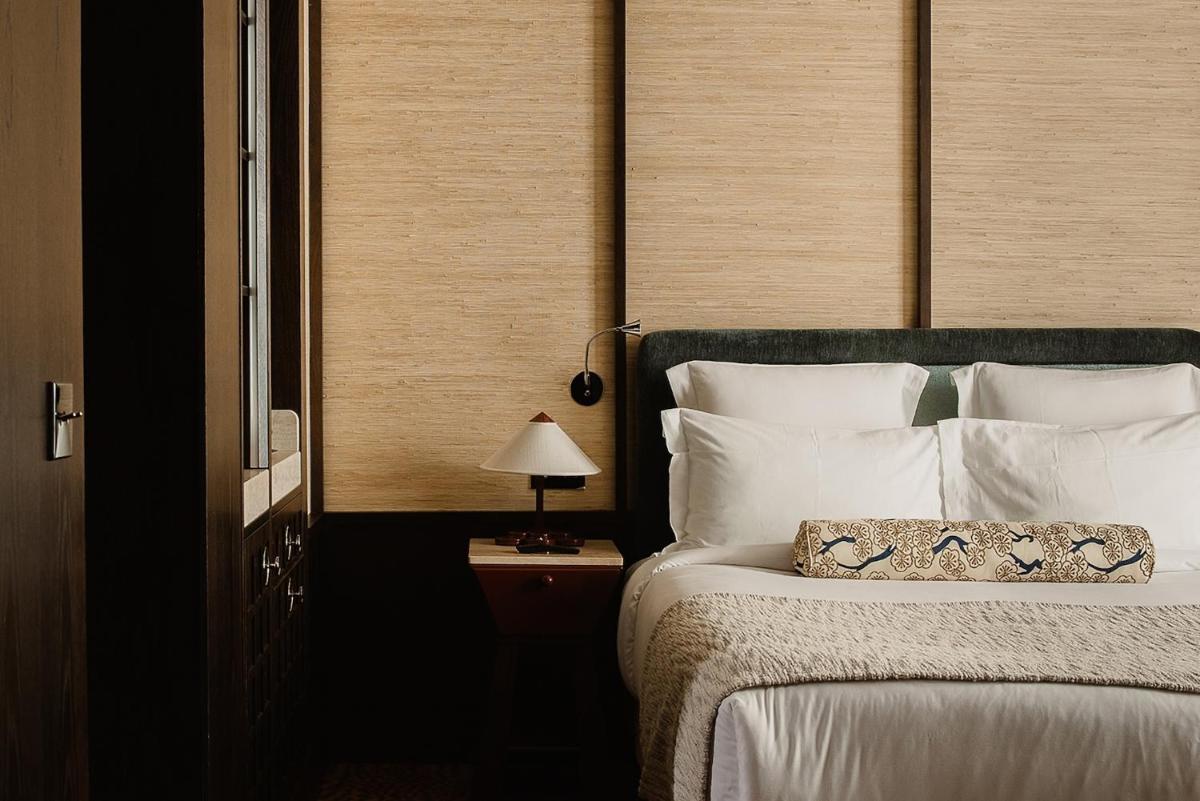 Un ou plusieurs lits dans un hébergement de l'établissement Hotel Hana