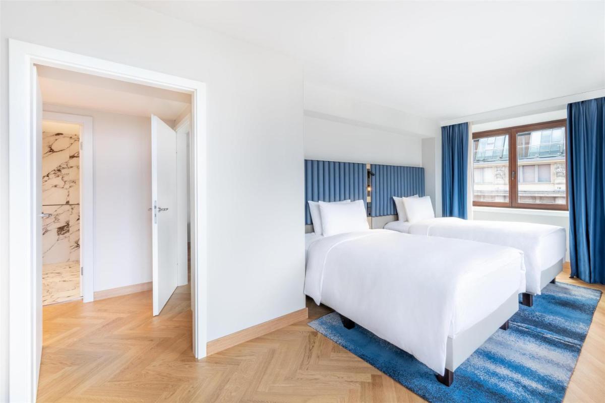 Ein Bett oder Betten in einem Zimmer der Unterkunft Hilton Berlin