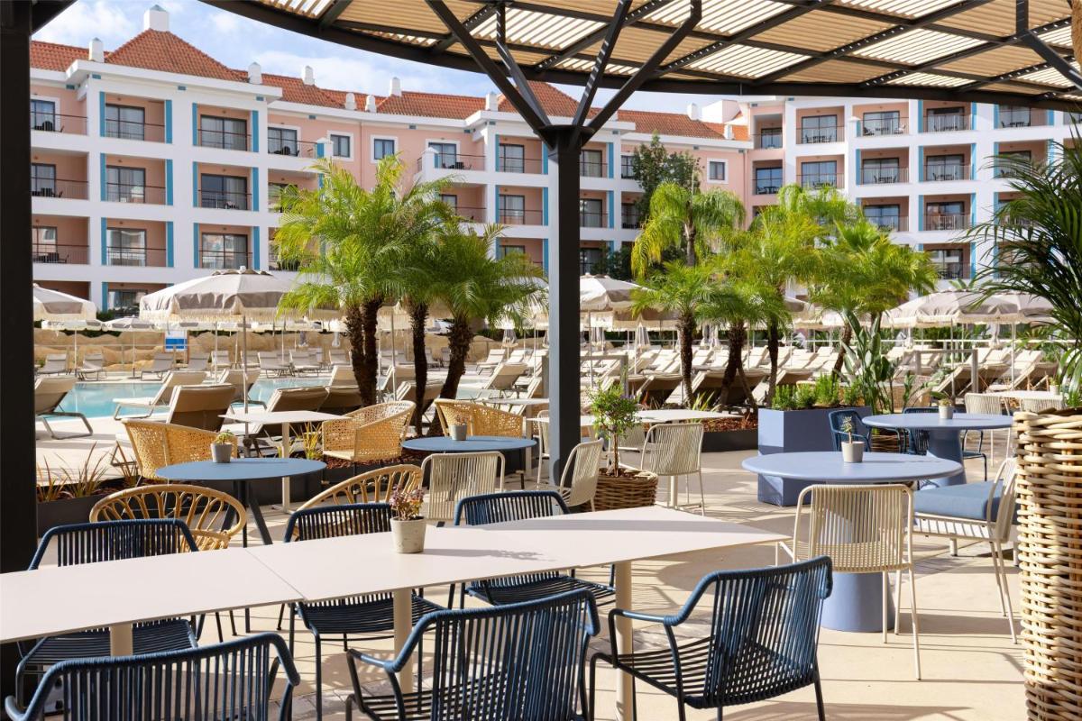 Um restaurante ou outro lugar para comer em Hilton Vilamoura