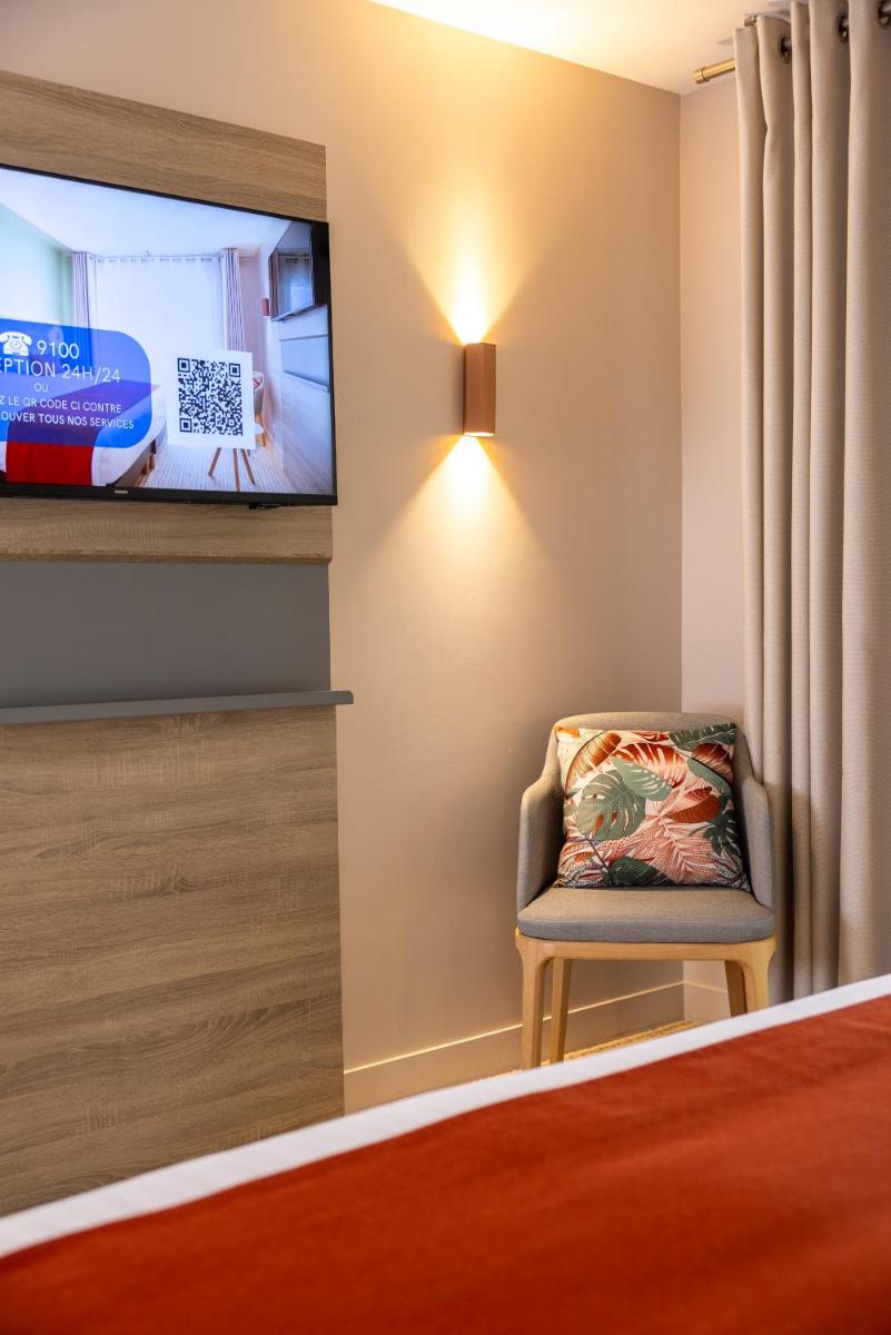 Télévision ou salle de divertissement dans l'établissement Hôtel & Spa Vitalparc, The Originals Collection
