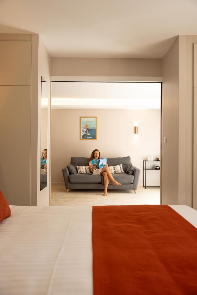 Un ou plusieurs lits dans un hébergement de l'établissement Hôtel & Spa Vitalparc, The Originals Collection