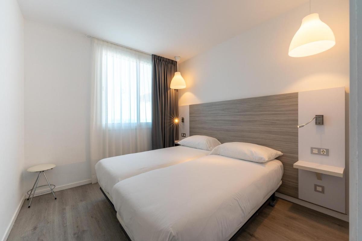 Cama o camas de una habitación en Servatur Puerto Azul