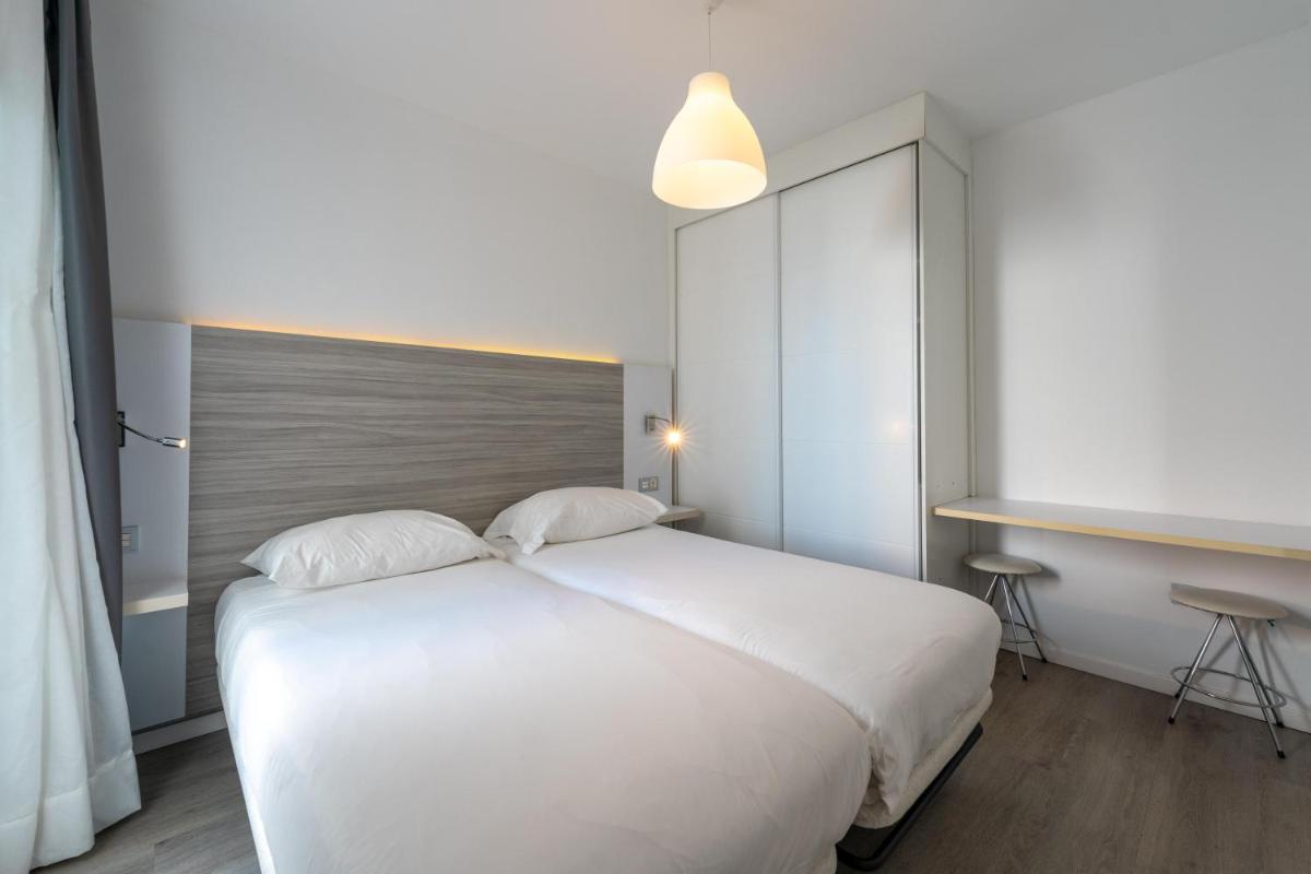 Cama o camas de una habitación en Servatur Puerto Azul