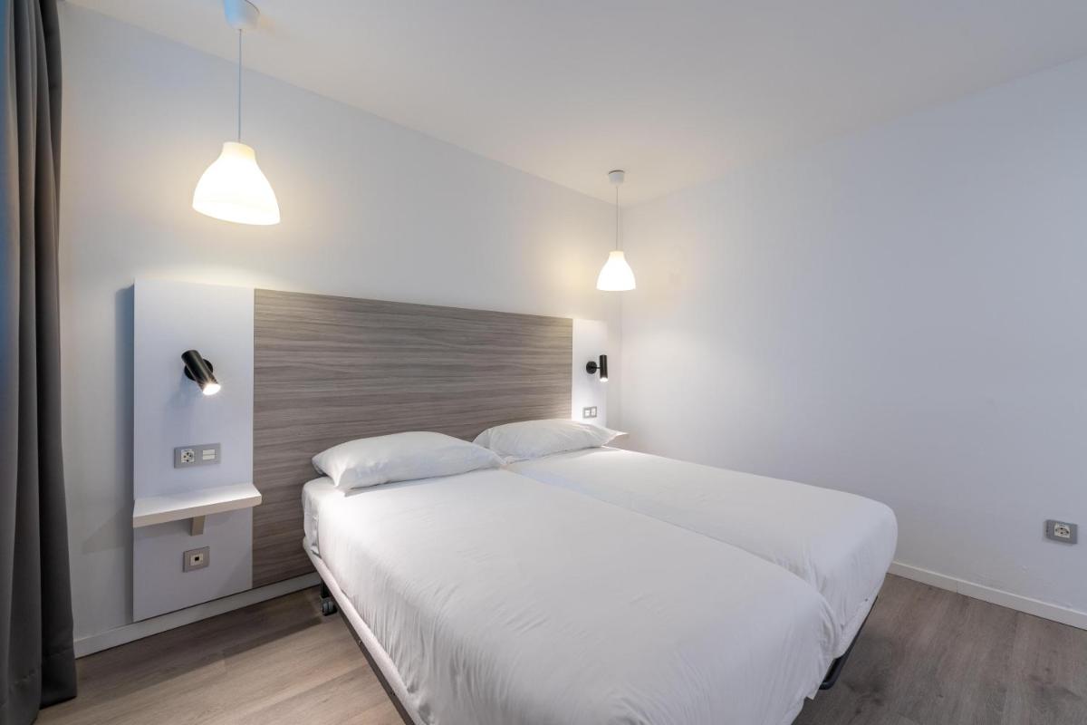 Cama o camas de una habitación en Servatur Puerto Azul