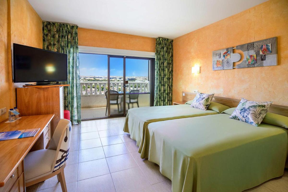 Cama o camas de una habitación en Hotel Servigroup La Zenia 4 Sup