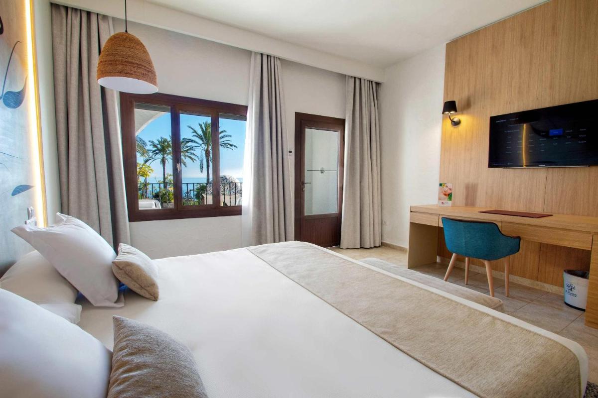 Cama o camas de una habitación en Hotel Servigroup Montíboli