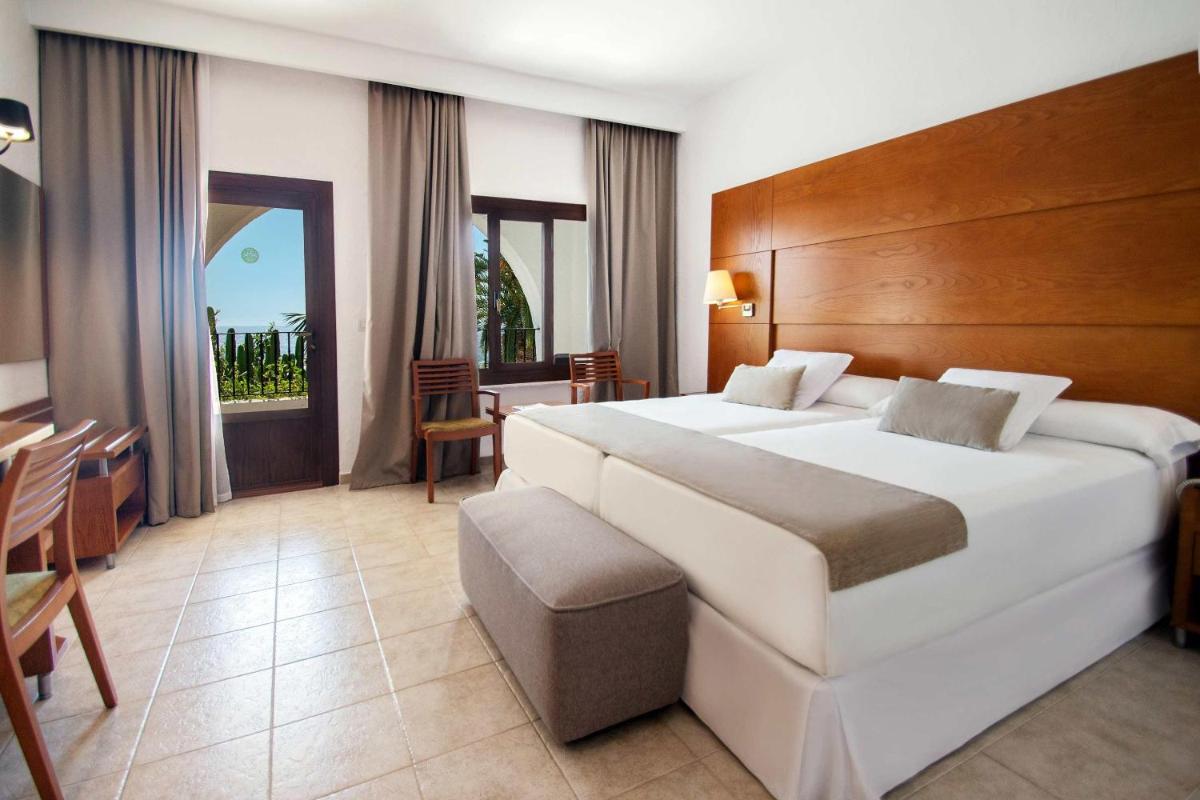 Cama o camas de una habitación en Hotel Servigroup Montíboli
