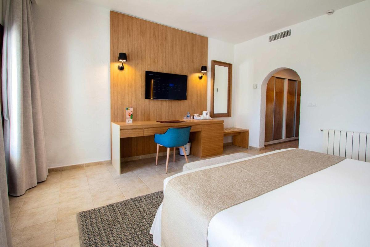 Cama o camas de una habitación en Hotel Servigroup Montíboli