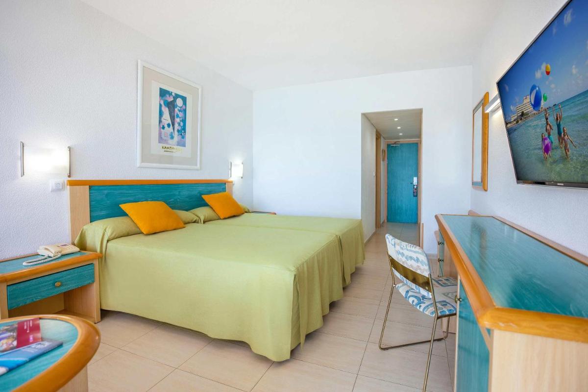 Cama o camas de una habitación en Hotel Servigroup Galua