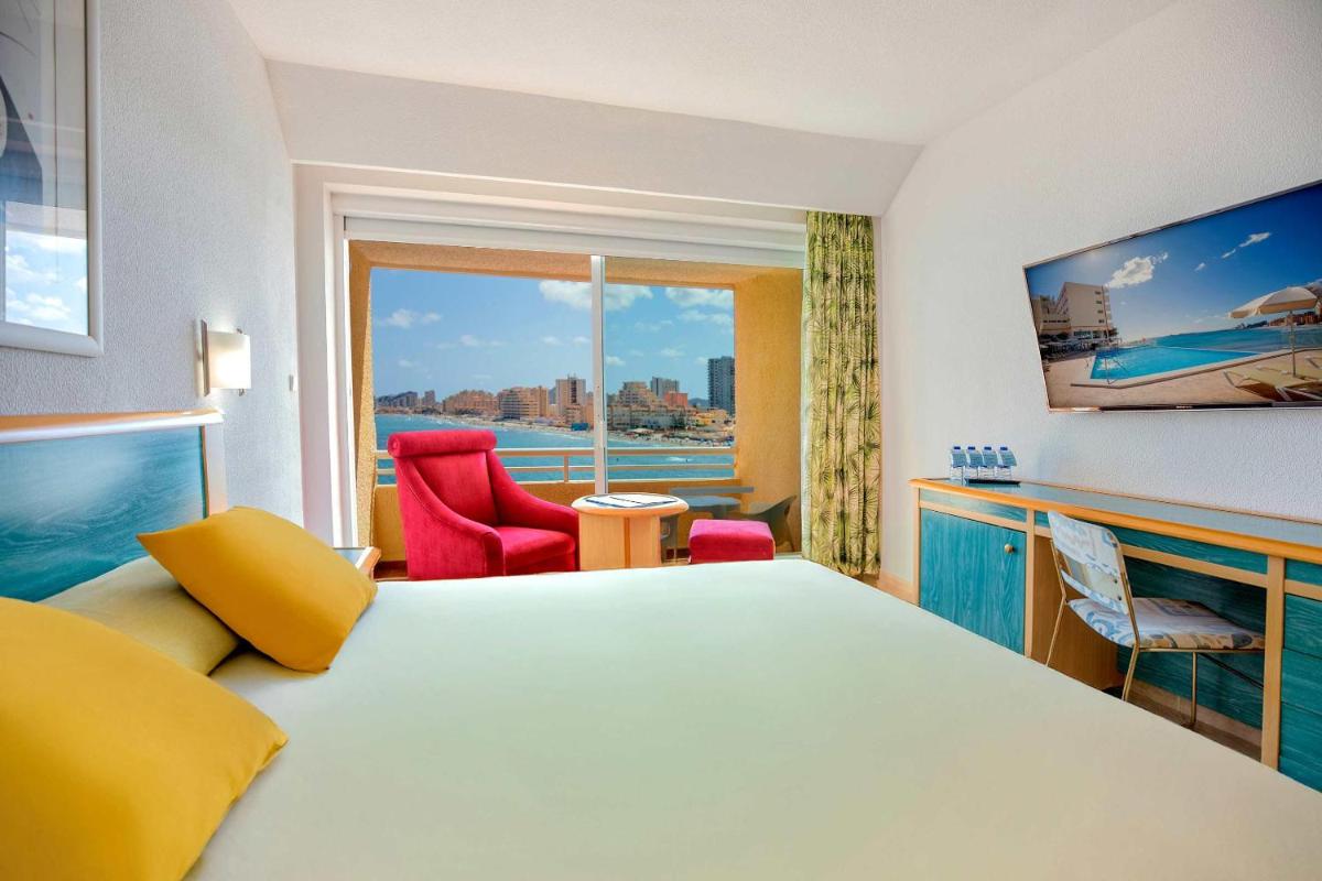 Cama o camas de una habitación en Hotel Servigroup Galua