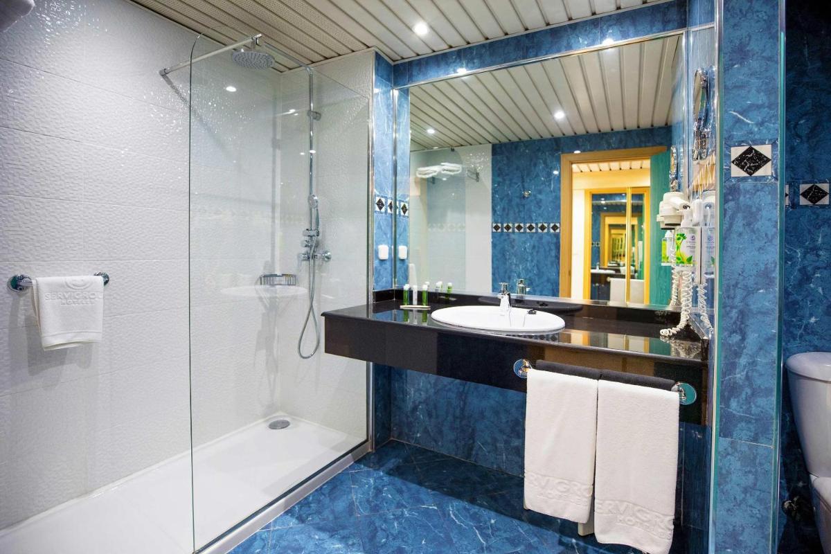 Un baño de Hotel Servigroup Galua