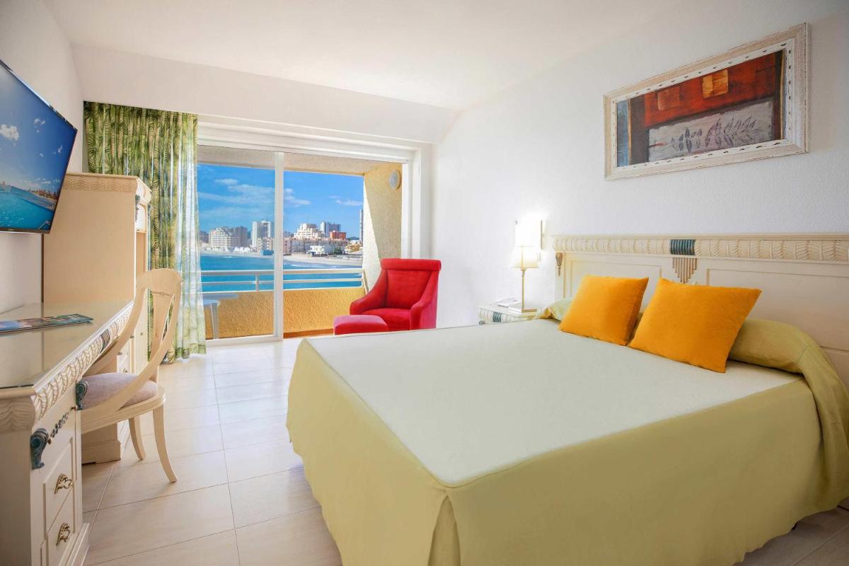 Cama o camas de una habitación en Hotel Servigroup Galua